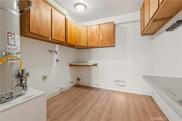 a view of a storage & utility room with a sink