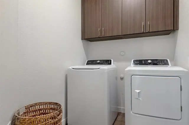 a view of storage and utility room with washer and dryer