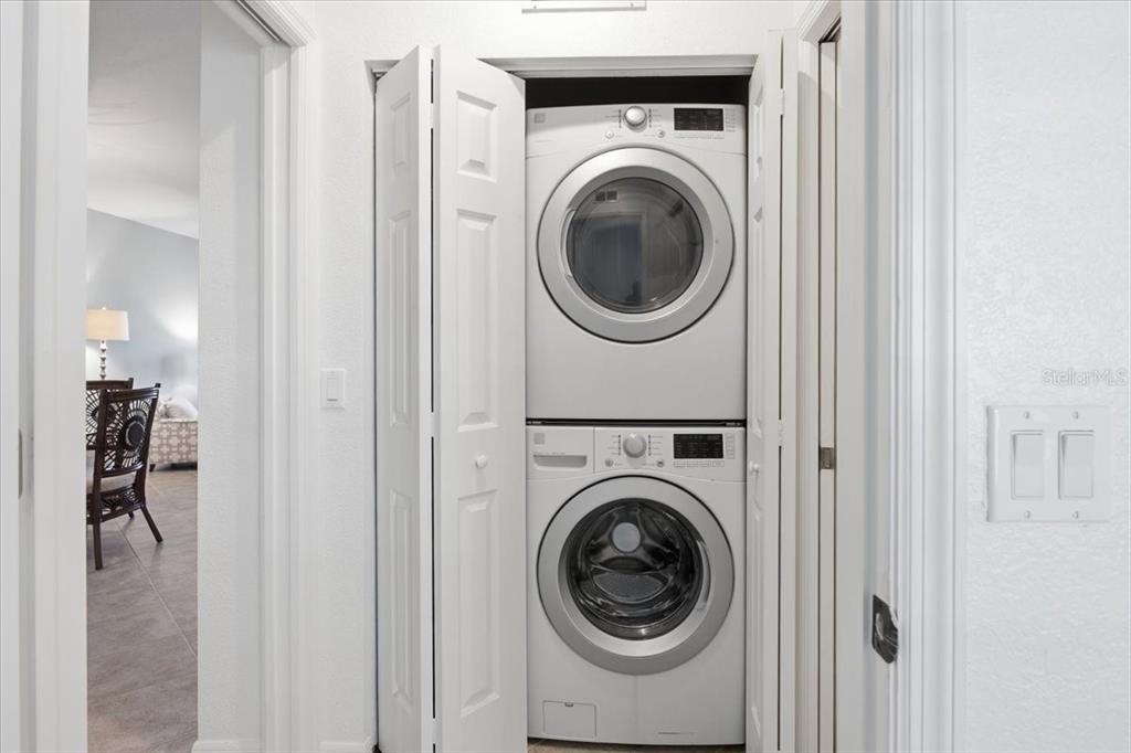 8411 Placida Road, Unit 407 Placida, FL 33946 - Photo 25 of 43 a view of a hallway with washer and dryer