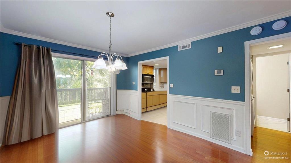 2825 Northeast Expressway, Unit L4 Atlanta, GA 30345 - Photo 11 of 36 a view of an entryway with wooden floor and a window