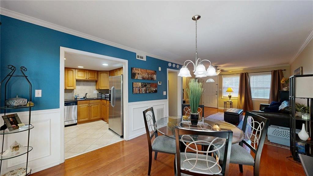 2825 Northeast Expressway, Unit L4 Atlanta, GA 30345 - Photo 12 of 36 a view of a dining room with furniture window and wooden floor