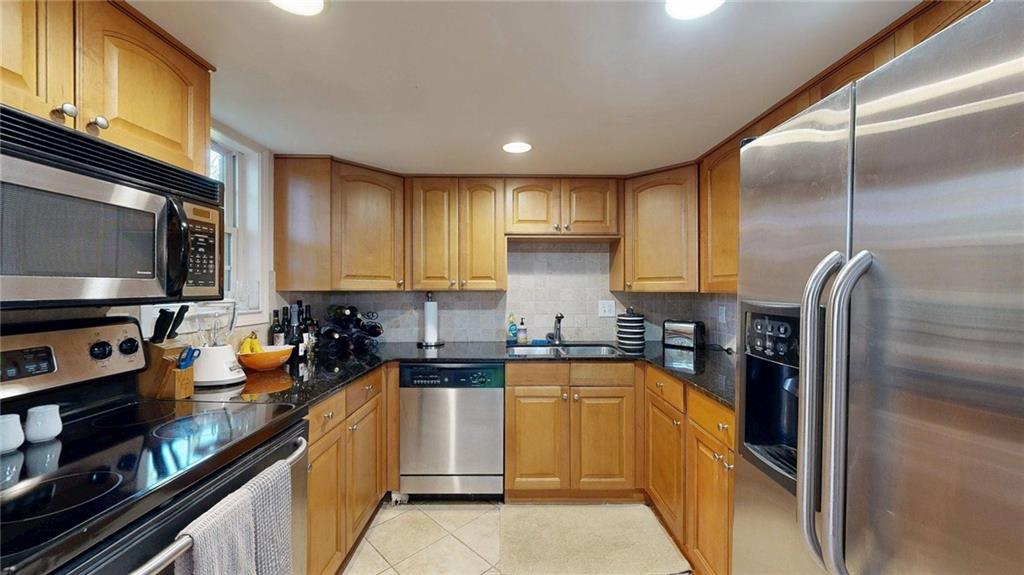 2825 Northeast Expressway, Unit L4 Atlanta, GA 30345 - Photo 13 of 36 a kitchen with a sink stainless steel appliances and cabinets
