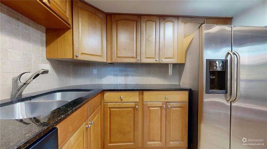 2825 Northeast Expressway, Unit L4 Atlanta, GA 30345 - Photo 14 of 36 a kitchen with granite countertop stainless steel appliances and cabinets