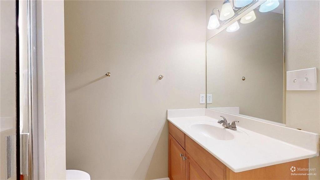 2825 Northeast Expressway, Unit L4 Atlanta, GA 30345 - Photo 19 of 36 a bathroom with a sink vanity and a mirror