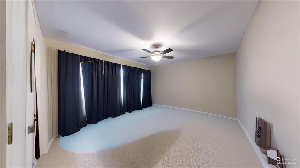 2825 Northeast Expressway, Unit L4 Atlanta, GA 30345 - Photo 24 of 36 a view of a livingroom with a ceiling fan and carpet