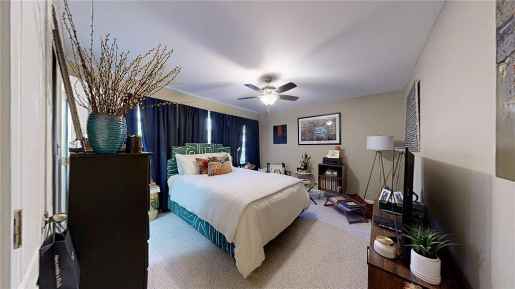 2825 Northeast Expressway, Unit L4 Atlanta, GA 30345 - Photo 25 of 36 a bed room with a bed and a television