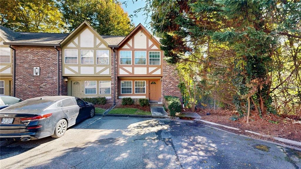 2825 Northeast Expressway, Unit L4 Atlanta, GA 30345 - Photo 27 of 36 a front view of a residential apartment building with a yard