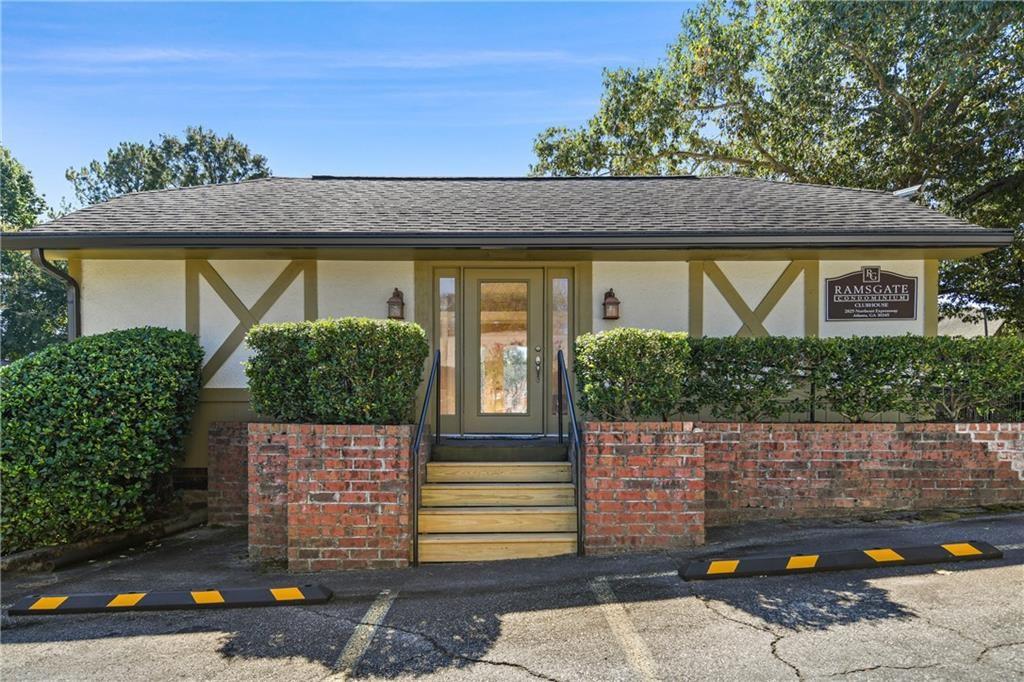 2825 Northeast Expressway, Unit L4 Atlanta, GA 30345 - Photo 29 of 36 a front view of a house with a yard