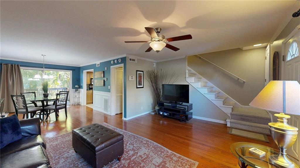 2825 Northeast Expressway, Unit L4 Atlanta, GA 30345 - Photo 6 of 36 a living room with furniture a dining table and a piano table