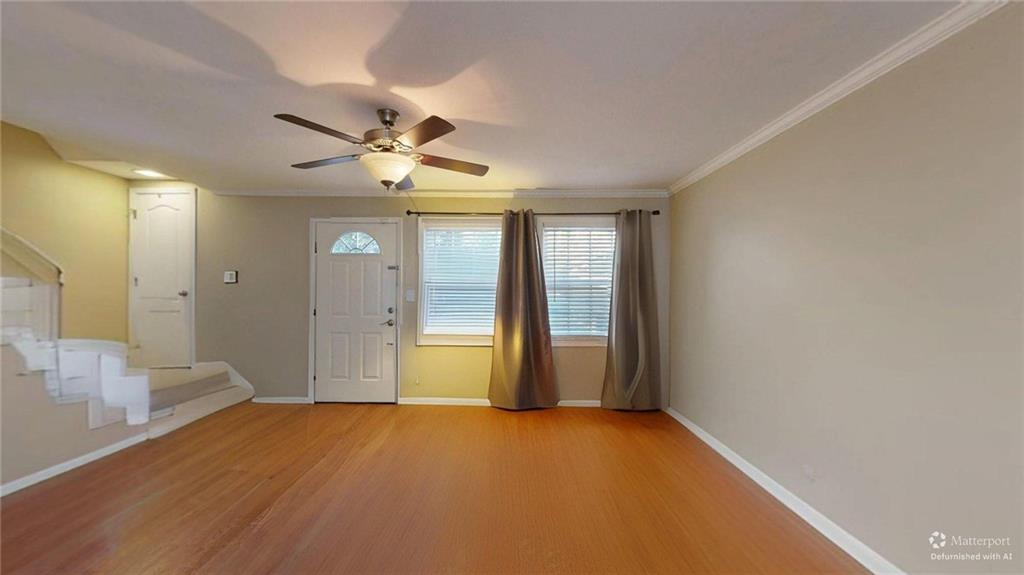 2825 Northeast Expressway, Unit L4 Atlanta, GA 30345 - Photo 8 of 36 a view of a big room with windows and chandelier fan
