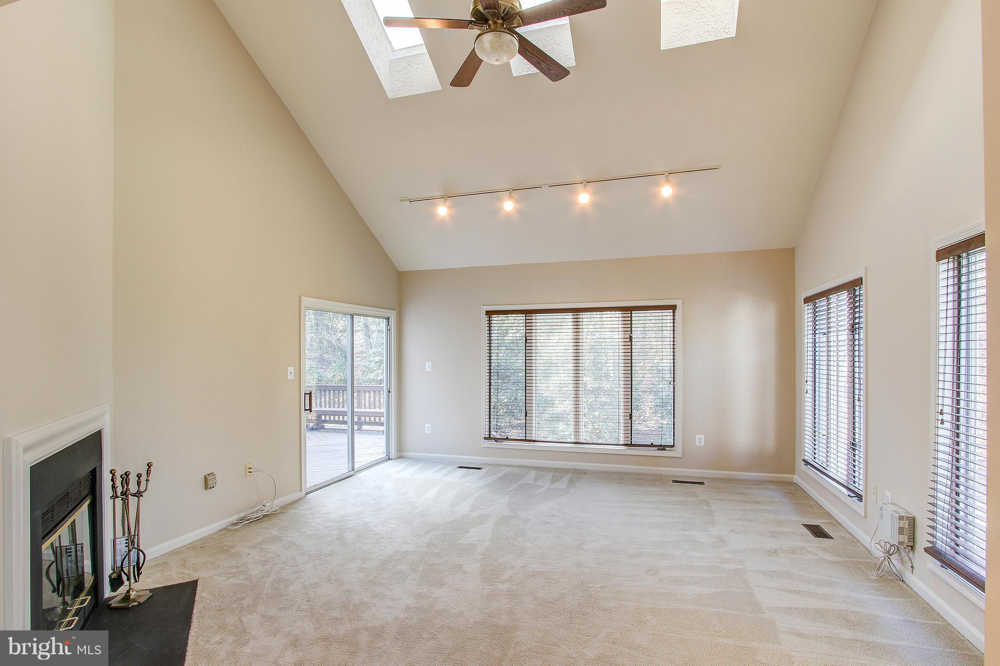 1274 Wedgewood Manor Way Reston, VA 20194 - Photo 9 of 30 Living Room with skylights and access to deck!