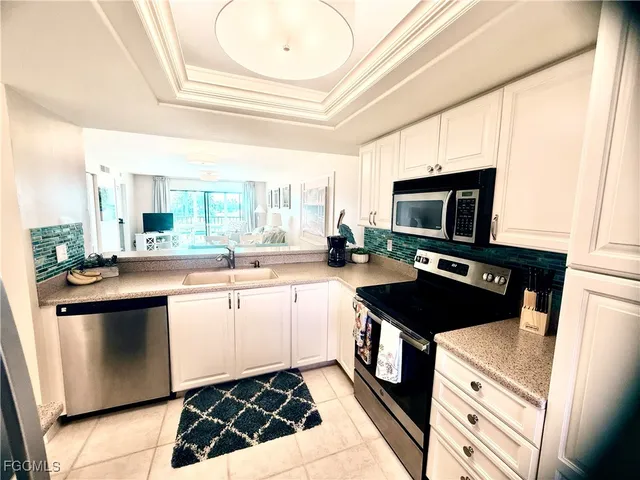 a stove top oven sitting inside of a kitchen