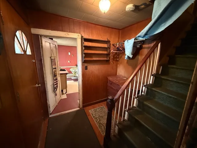 a view of staircase with wooden floor and stairs