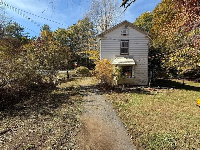 a front view of house with an outdoor space