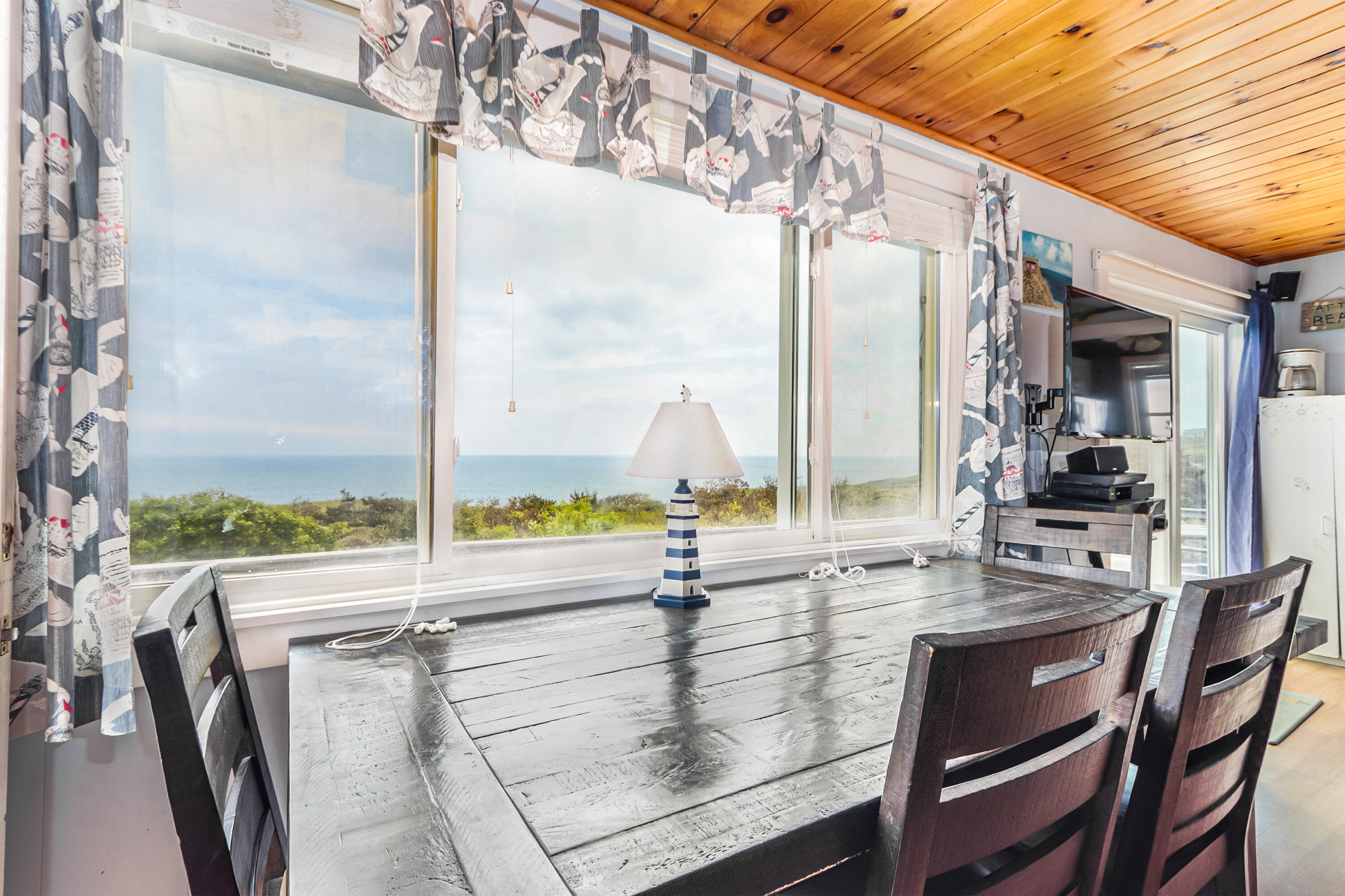 440 Nellie Road Wellfleet, MA 02667 - Photo 15 of 22 a view of a dining room with furniture window and outside view