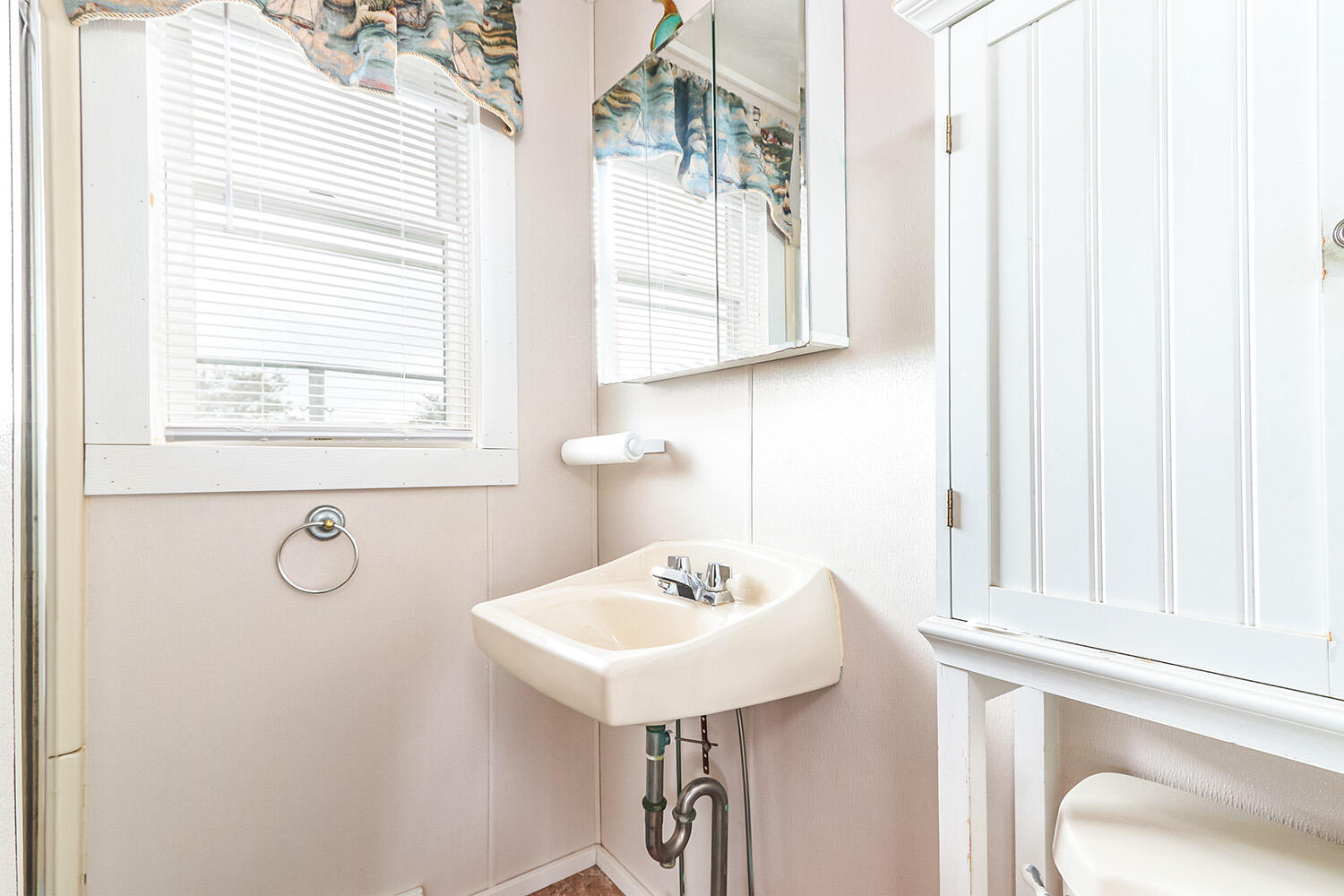 440 Nellie Road Wellfleet, MA 02667 - Photo 18 of 22 a bathroom with a sink a mirror and a window