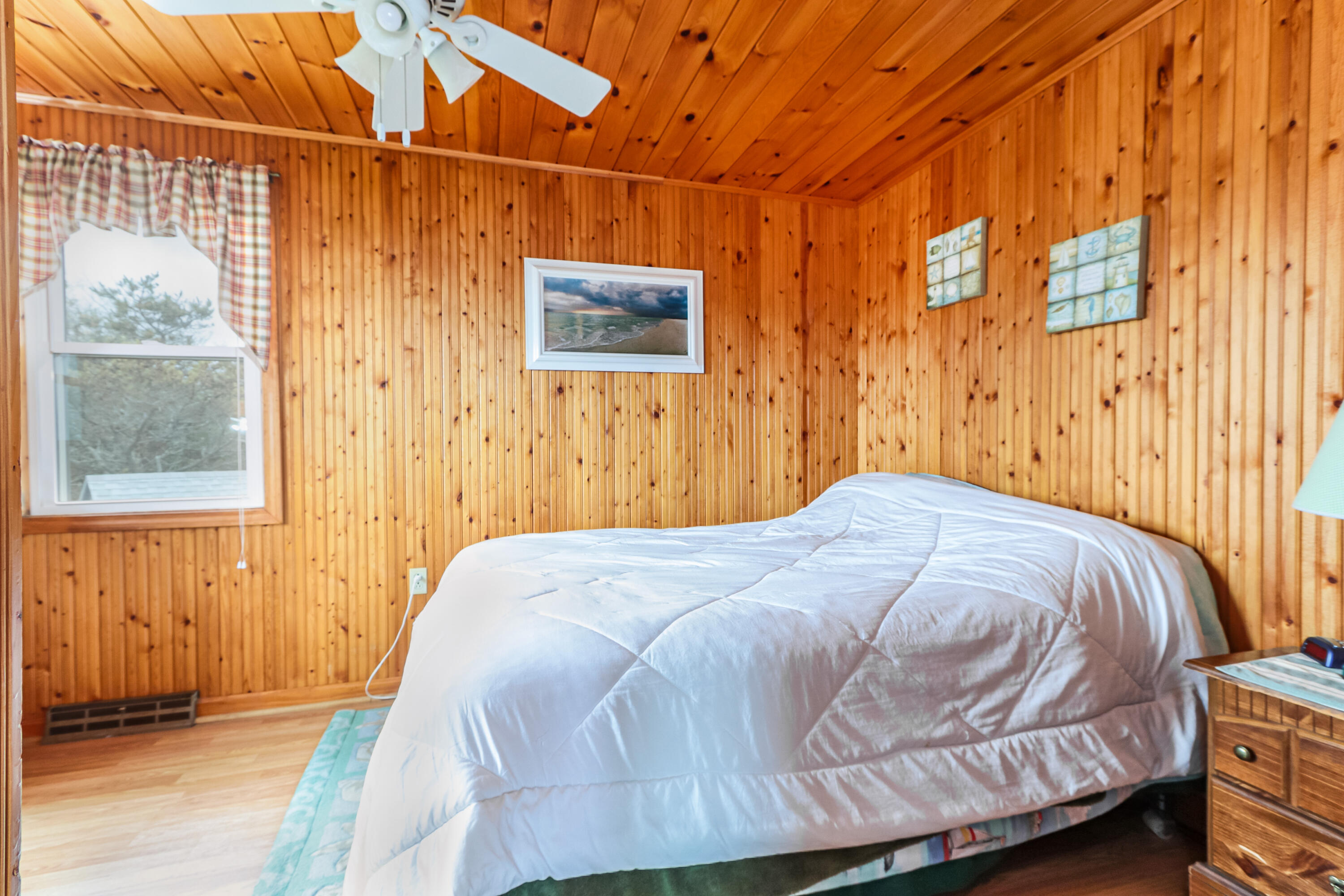 440 Nellie Road Wellfleet, MA 02667 - Photo 19 of 22 a bedroom with a bed and a shower