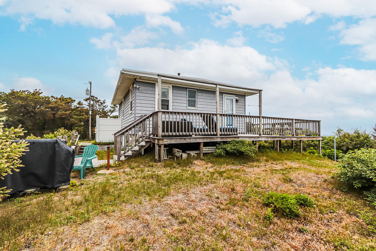 440 Nellie Road Wellfleet, MA 02667 - Photo 9 of 22 a view of a house with swimming pool next to a yard