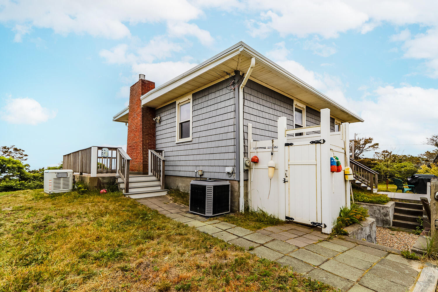 440 Nellie Road Wellfleet, MA 02667 - Photo 10 of 22 a view of a house with a sink and chairs