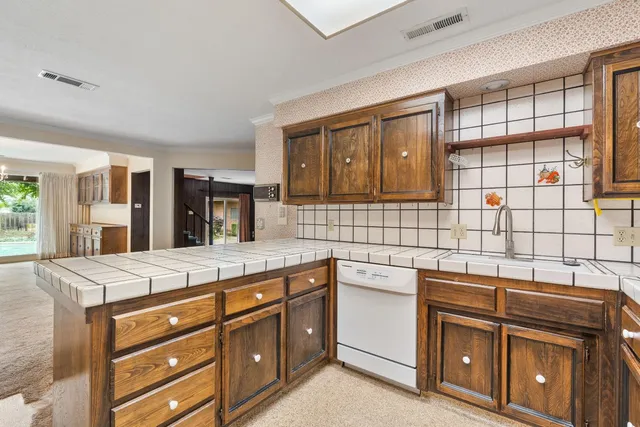 a view of an empty room with a floor to ceiling window and yard