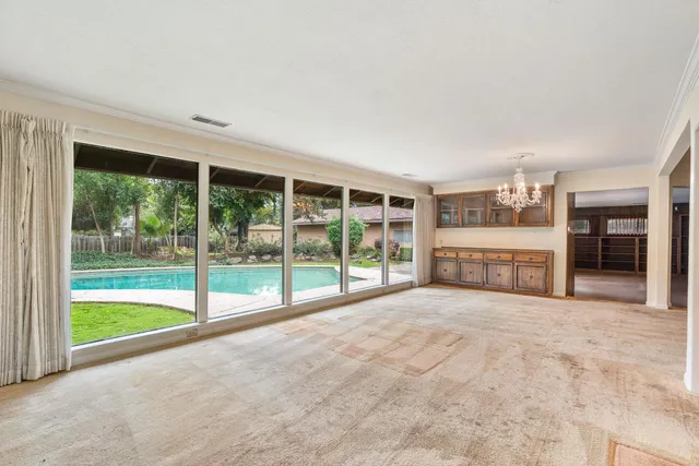 a view of an empty room with a closet