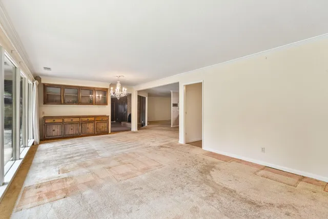 a view of an empty room with windows