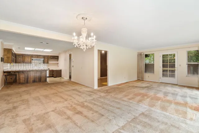 a view of an empty room with windows