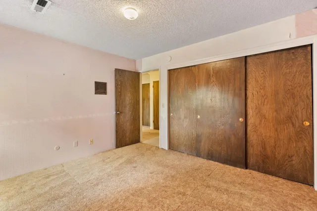 a bathroom with a granite countertop sink a mirror a and a bathtub