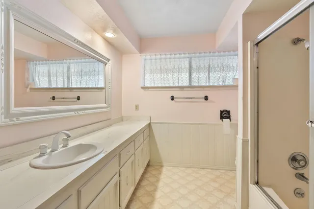 a view of a house with swimming pool and a yard