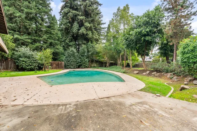 a view of a backyard with a tub