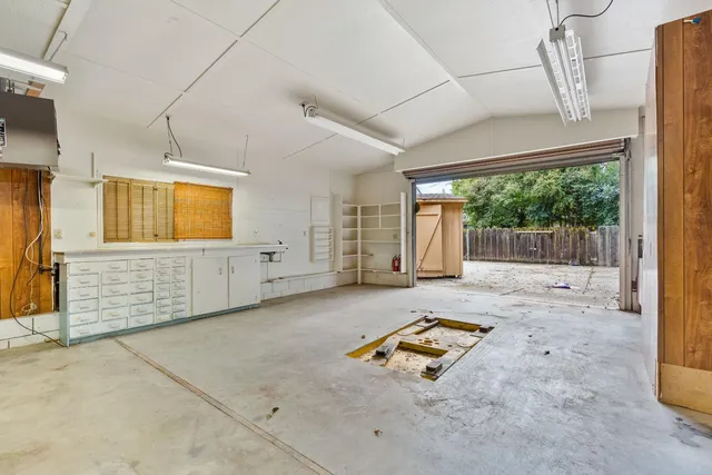 an aerial view of a house with a swimming pool