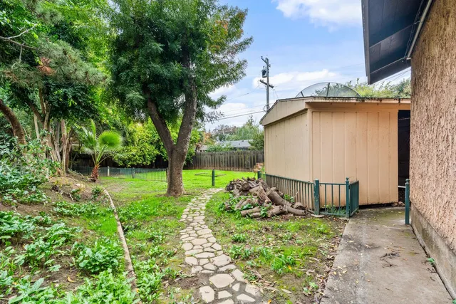an aerial view of a house with garden space and street view
