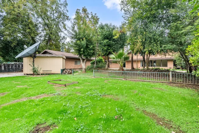 an aerial view of a house with yard outdoor seating and yard