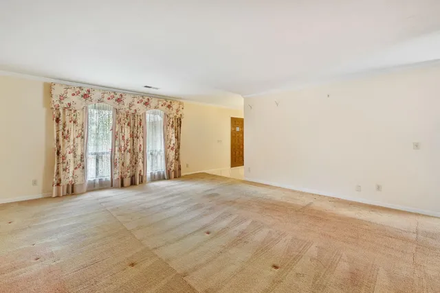 a view of a bathroom with a sink and a mirror