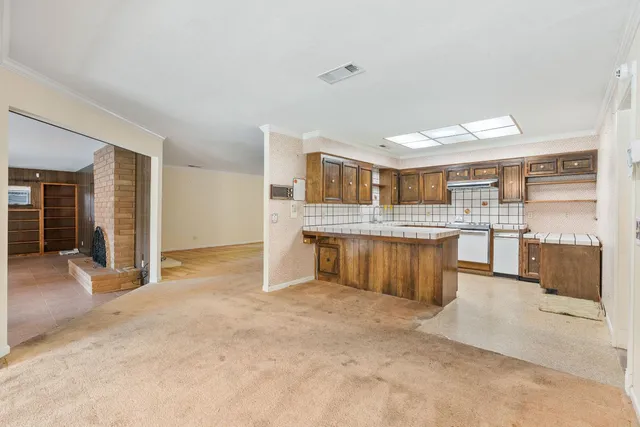 a kitchen that has a sink and a stove