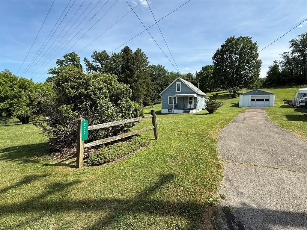 222 Bagdad Road Leechburg, PA 15656 - Photo 3 of 23 a view of a house with a yard and sitting area
