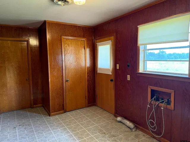 a view of a backyard with a garden and entertaining space