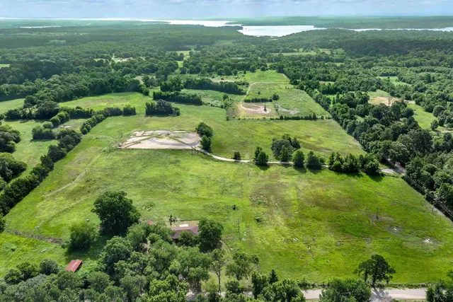 a view of a green yard with houses