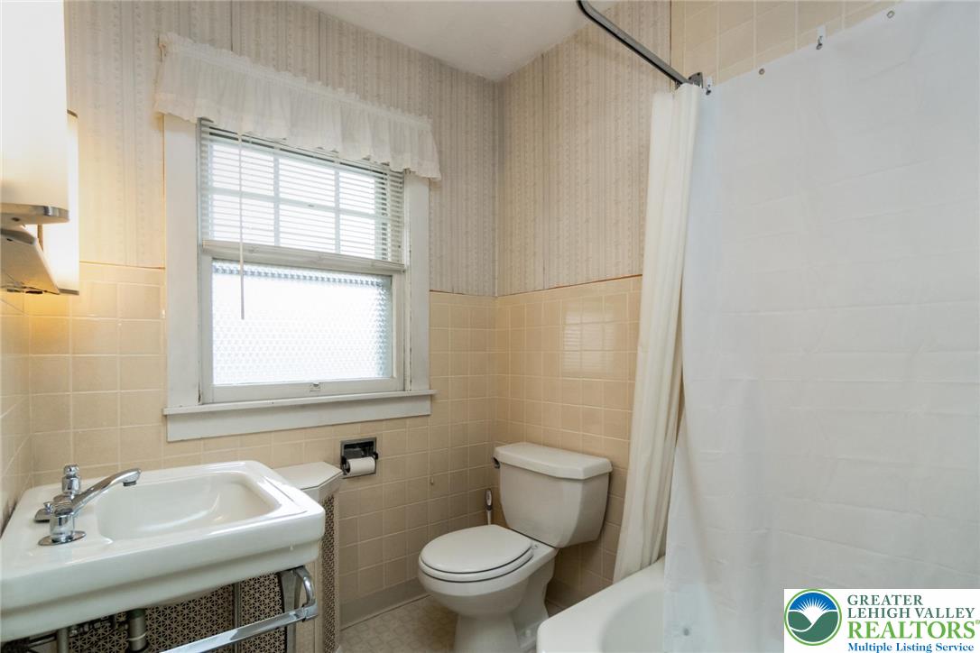 2003 Kemmerer Street Bethlehem, PA 18017 - Photo 30 of 49 a bathroom with a sink toilet and a mirror