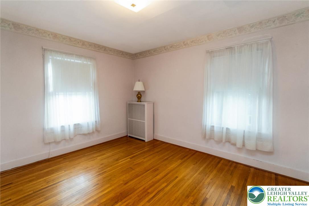 2003 Kemmerer Street Bethlehem, PA 18017 - Photo 41 of 49 an empty room with wooden floor and windows