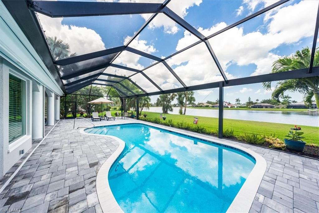 2137 Imperial Circle Naples, FL 34110 - Photo 26 of 29 a view of swimming pool with a patio