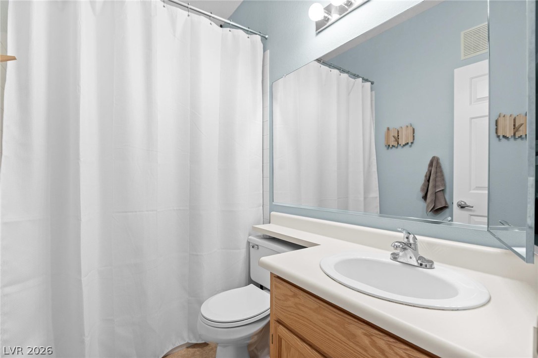 3238 Mystic Ridge Court Las Vegas, NV 89129 - Photo 16 of 31 Functional full bathroom with a spacious vanity, large mirror, and full shower.