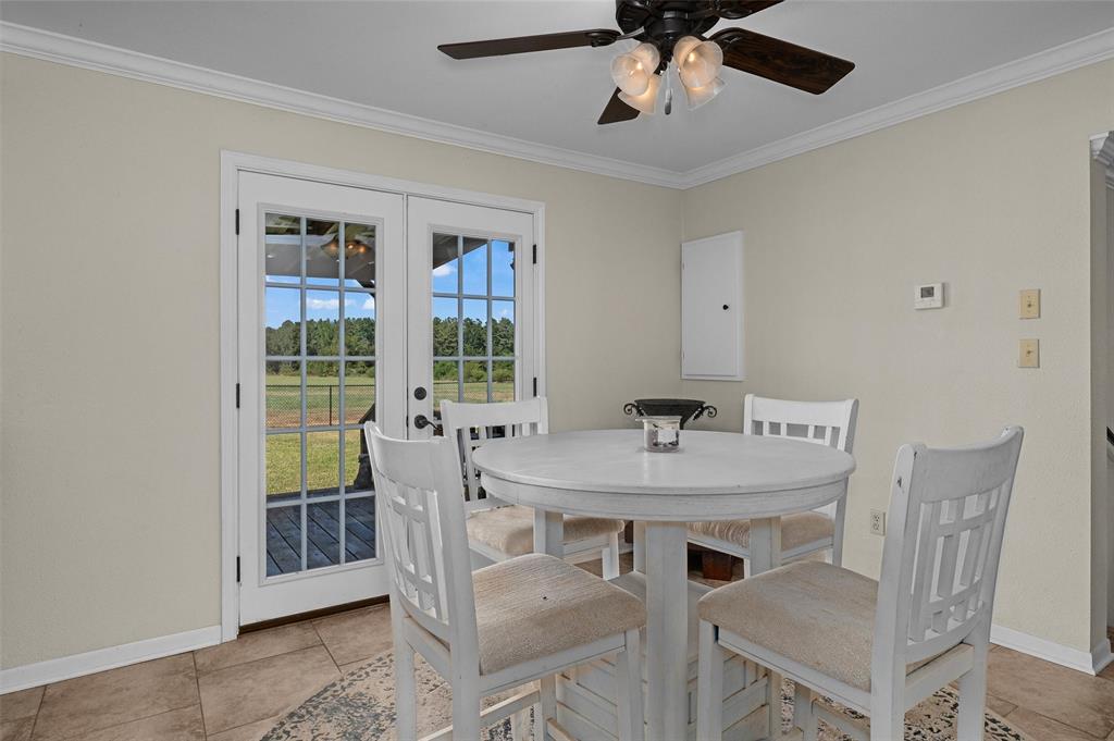 1131 Speights Road Keatchie, LA 71046 - Photo 21 of 33 White French doors with grid-patterned glass panels