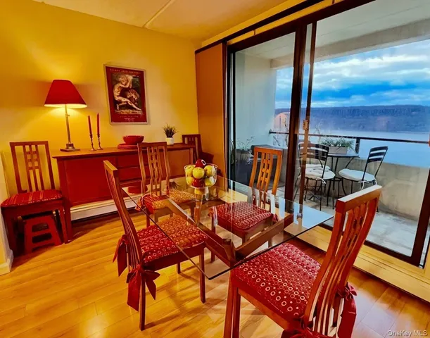 a dining room with furniture and wooden floor