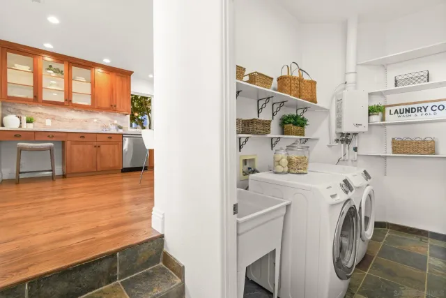 a view of a kitchen with refrigerator and washer