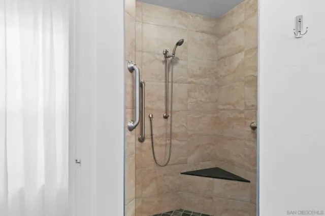 a bathroom with a glass shower door
