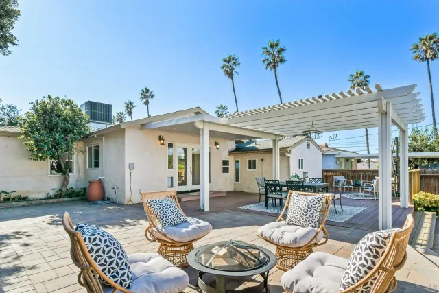 a view of a patio with couches table and chairs