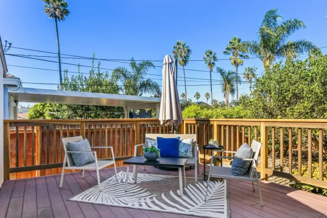 a view of a chairs on the roof deck