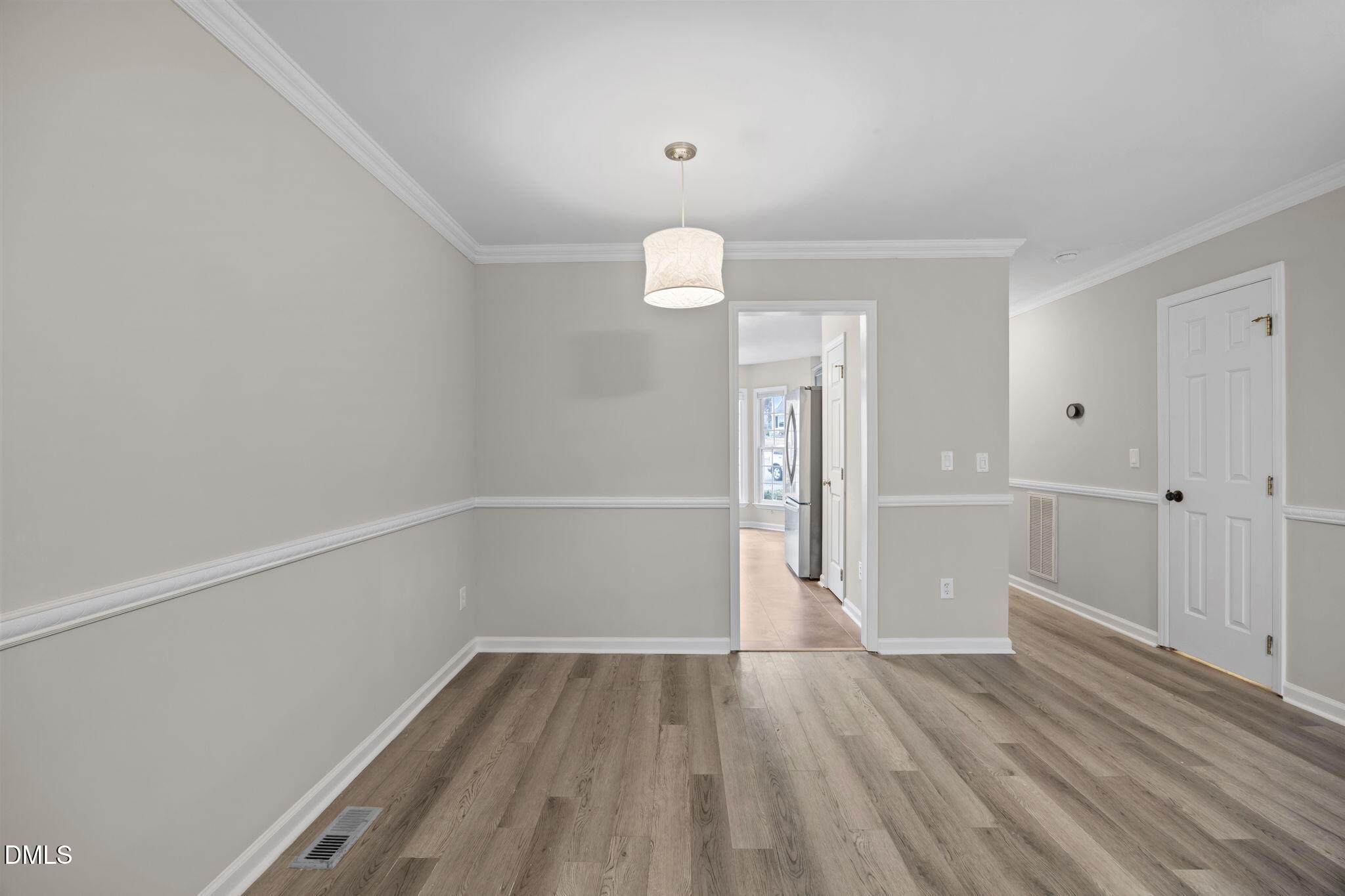 2813 Bedfordshire Court Raleigh, NC 27604 - Photo 20 of 44 a view of a room with wooden floor and window