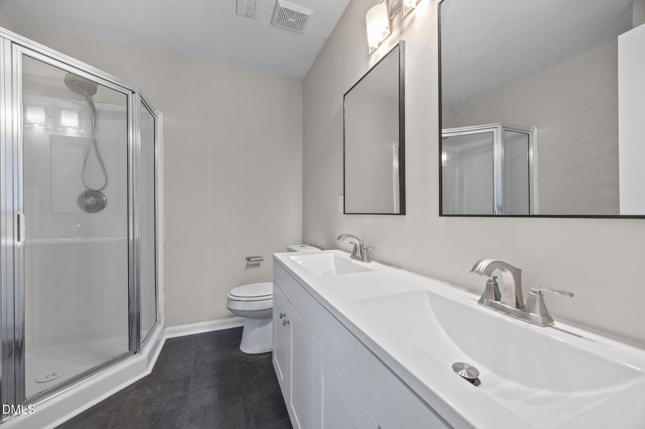 2813 Bedfordshire Court Raleigh, NC 27604 - Photo 31 of 44 a bathroom with a sink a toilet and shower